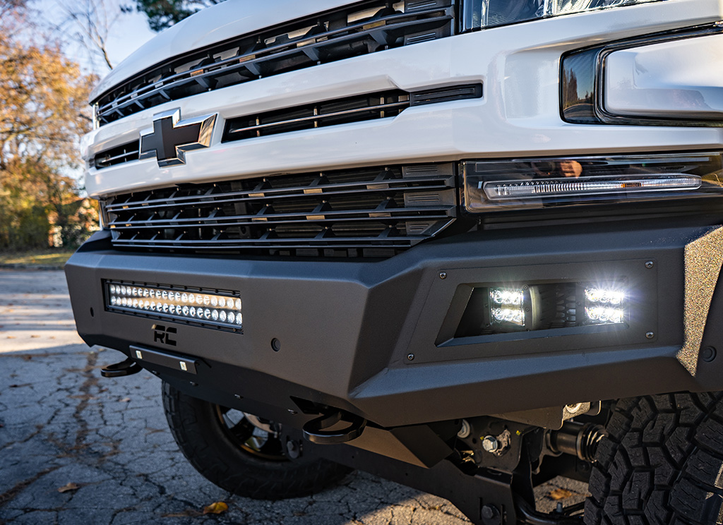 Rough Country offroad armored bumper with light bar.
