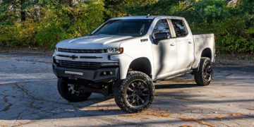 White 2022 Chevy Silverado customized with offroad mods and accessories.