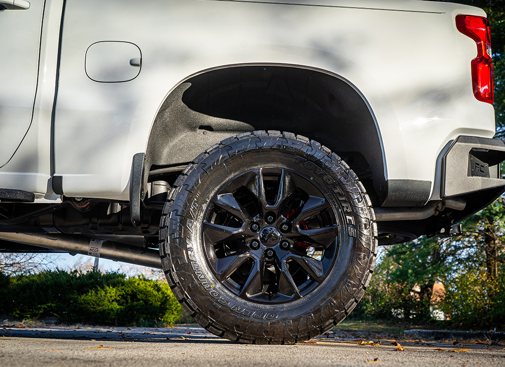 Black powder coated Chevy Silverado stock wheels.