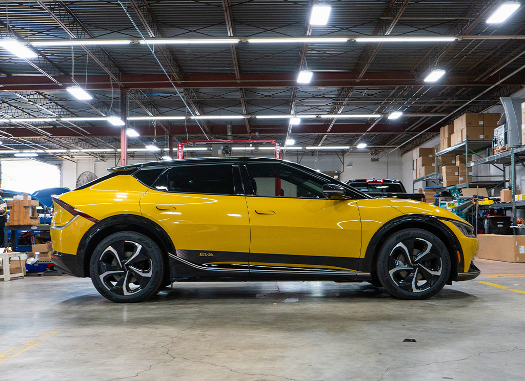 Profile view of a custom Urban Yellow Kia EV6
