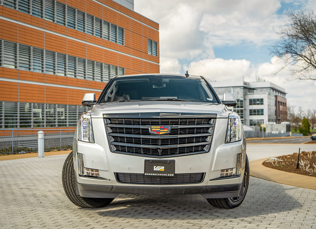 Custom 2019 Cadillac Escalade with a chrome delete and roof wrap