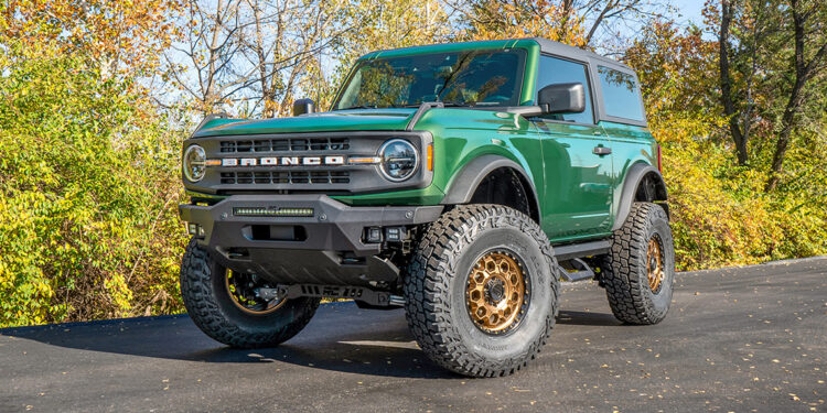Manual 2-door Eruption Green 2022 Ford Bronco with off road mods and upgrades.