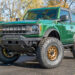 Manual 2-door Eruption Green 2022 Ford Bronco with off road mods and upgrades.