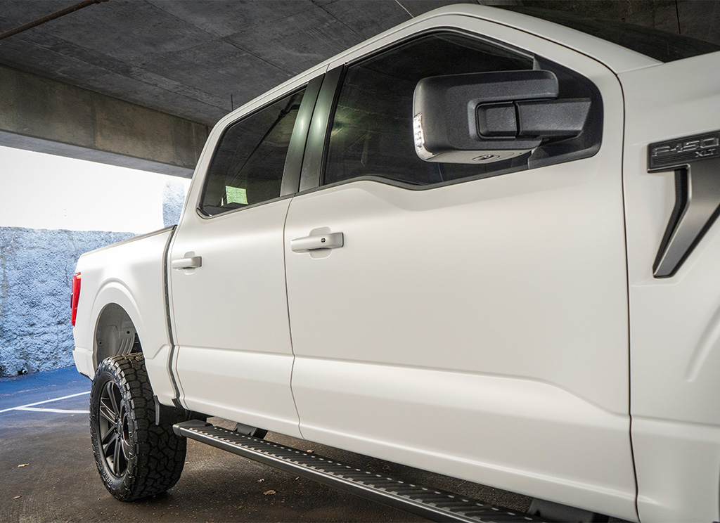 Close-up of the satin white finish on a Ford F-150.
