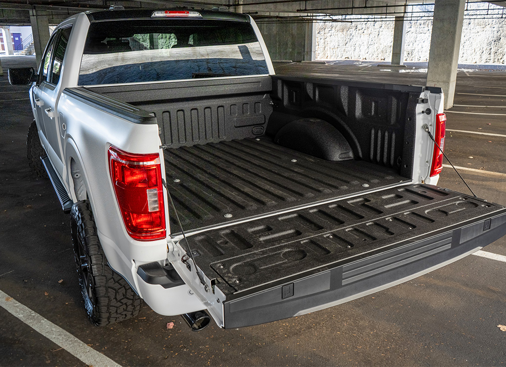 Spray-in bedliner in the truck bed of a 2022 Ford F-150.