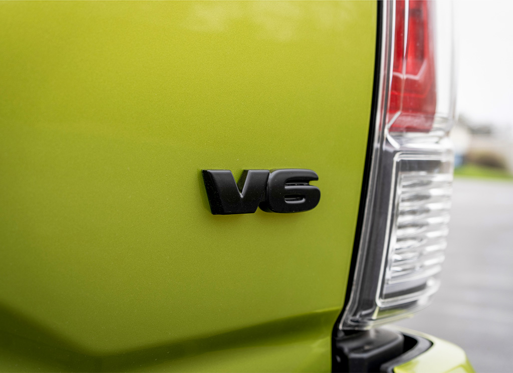 2023 Toyota Tacoma Black V6 emblem overlay