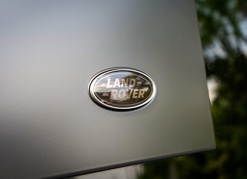 Tinted Land Rover emblem close up.