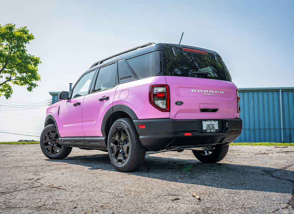 Rear view of vinyl wrapped pink Bronco Sport SUV