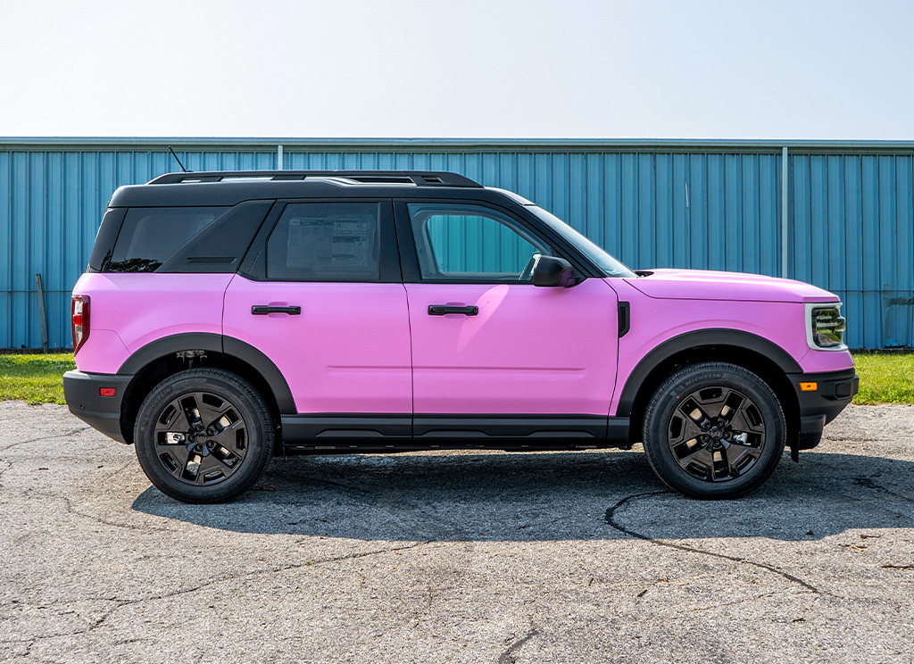 Side profile of a custom pink Bronco Sport SUV