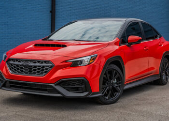 Custom red 2023 WRX with a chrome delete and two-tone wrap.