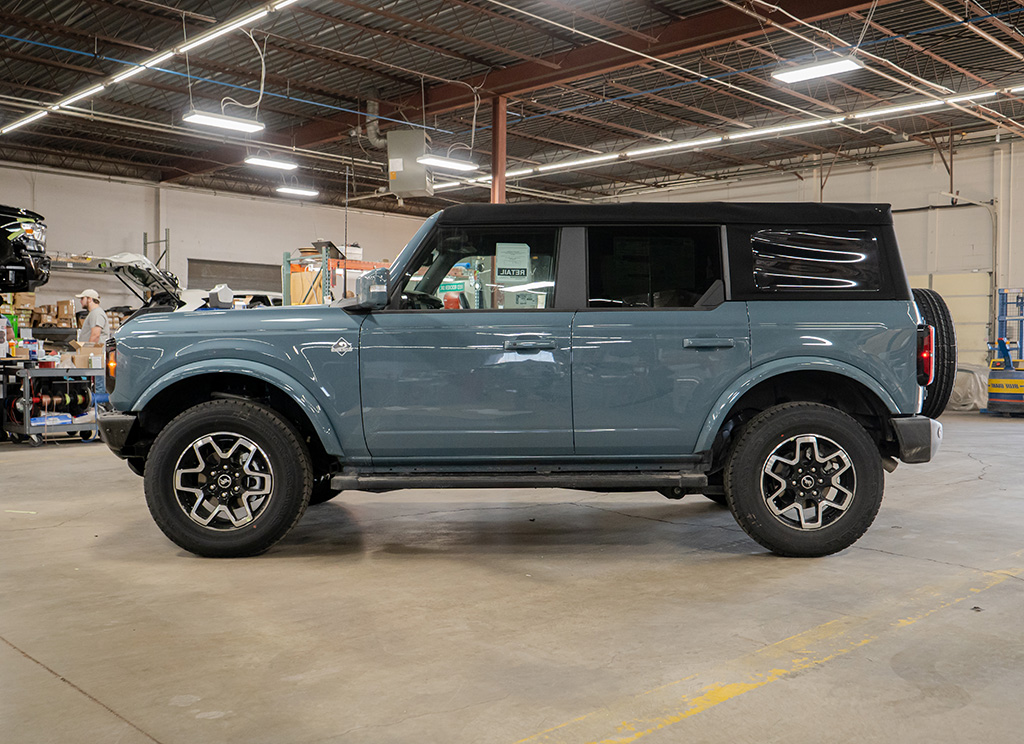 Profile view of a stock 2022 Ford Bronco in Area 51 color.
