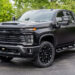 Custom blackout 2024 Chevy Silverado build with a satin black vinyl wrap.