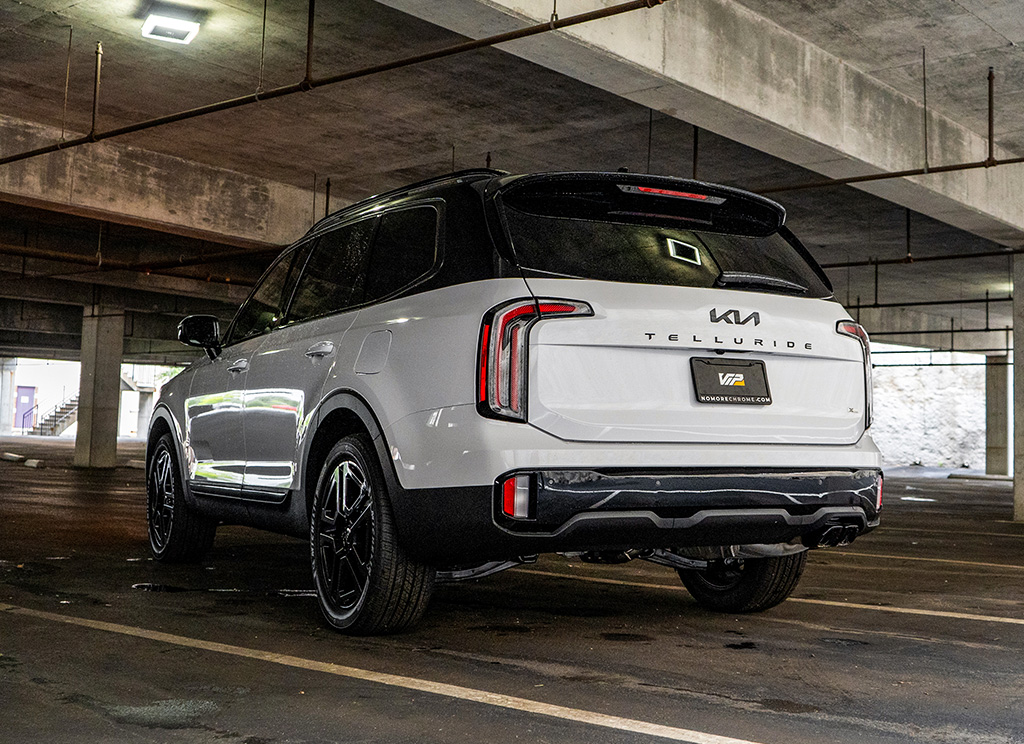 Rear angled view of a custom 2023 Kia Telluride with a chrome delete.