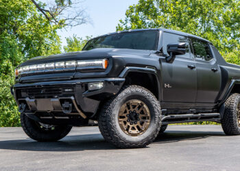 Custom 2024 Hummer EV Truck with a satin black wrap and bronze accents.