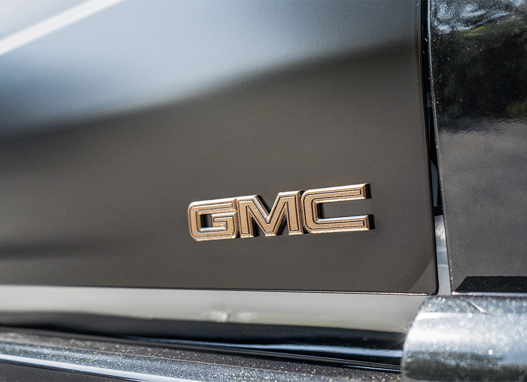 GMC emblem painted bronze aftermarket.