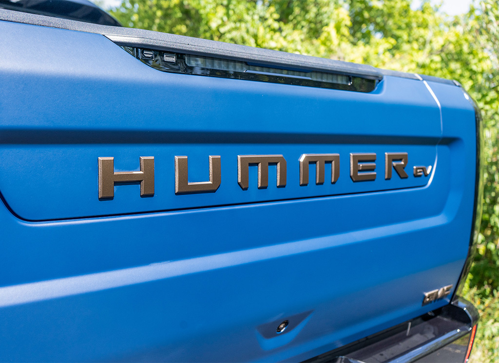 Hummer EV truck with a bronze tailgate nameplate
