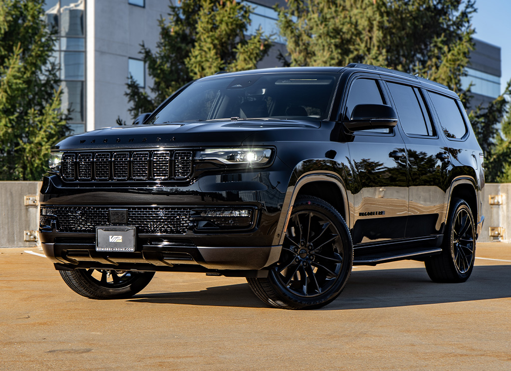 Blackout Jeep Wagoneer with dark tinted windows.