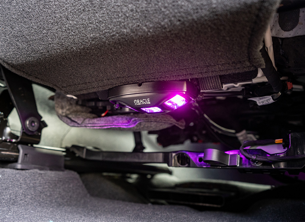 Oracle under seat RGB LED lighting accessory with purple light.