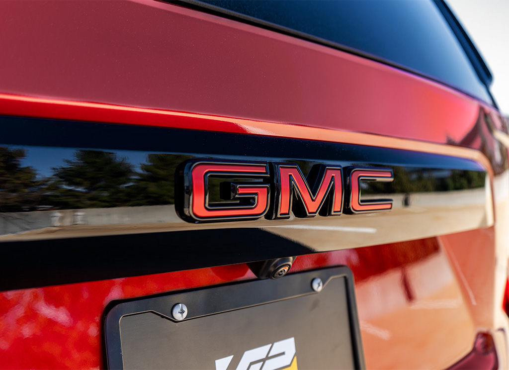 Chrome delete rear hatch valence and GMC emblem.