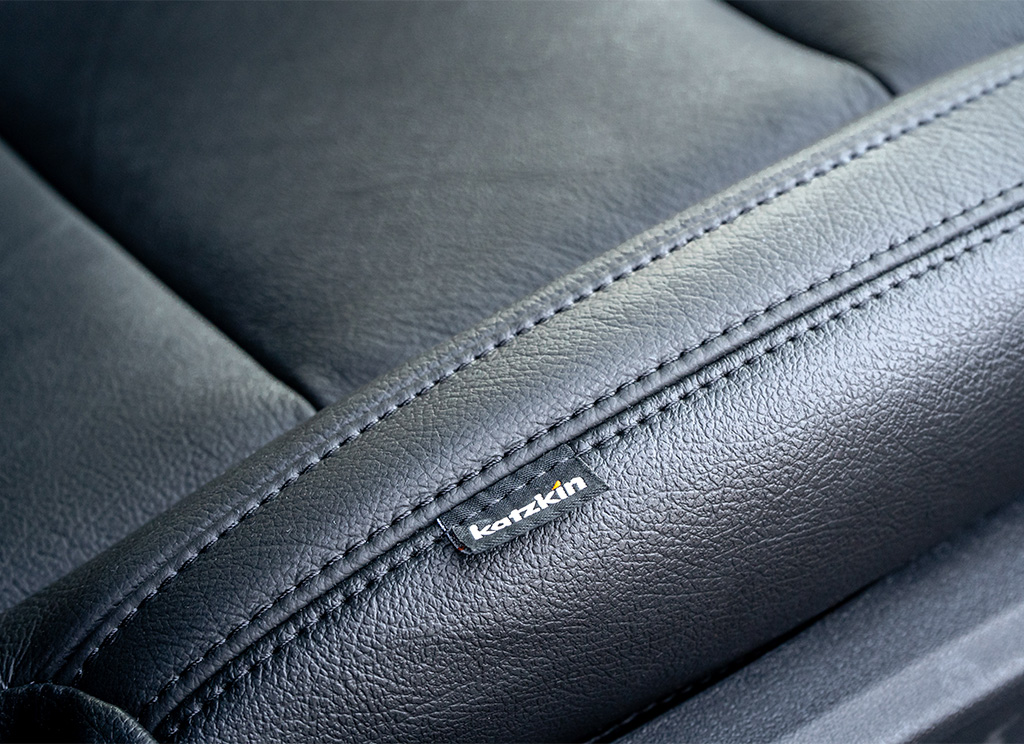 Close-up view of katzkin black leather upholstry.