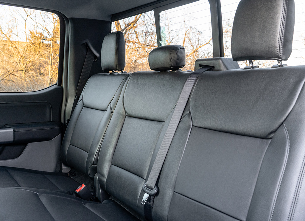 Black leather upholstery on the second row of seating in a Ford F-150.