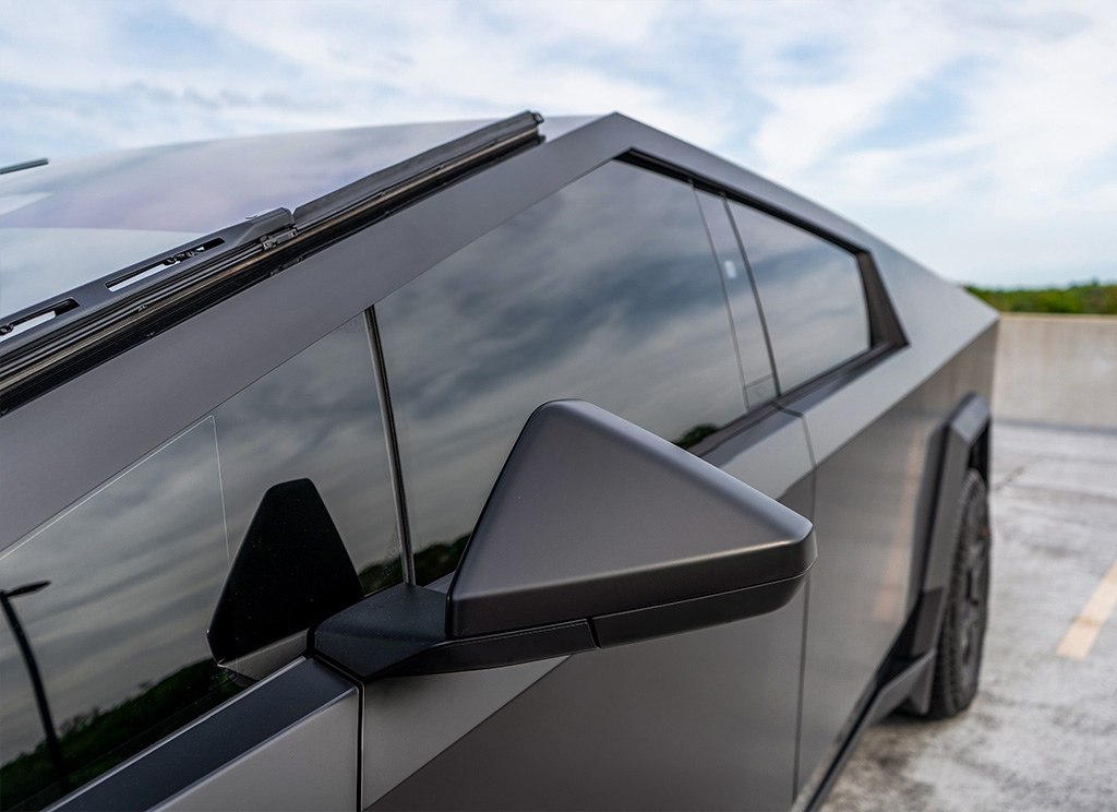 Dark tinted windows on a custom Tesla Cybertruck.