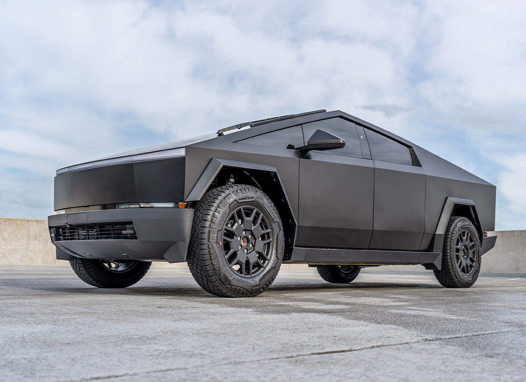 Custom Tesla Cybertruck with a satin black vinyl wrap, tinted windows, and ceramic coating.