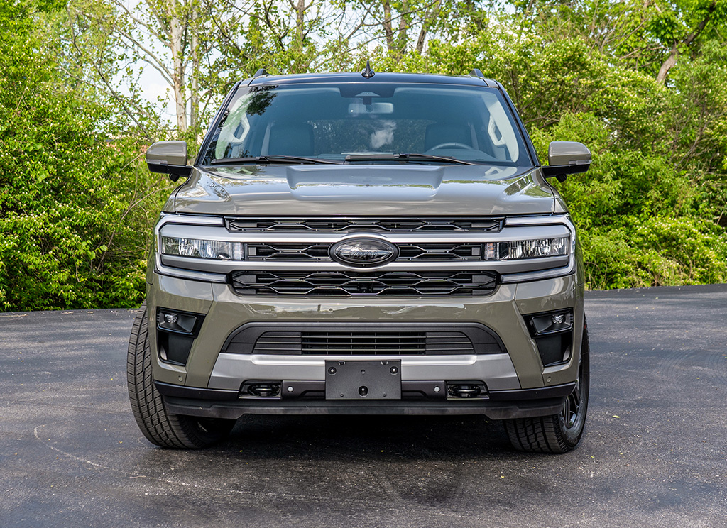 Blackout Front Ford emblem on a 2024 Wild Green Ford Expedition full-size SUV.