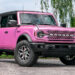 Custom Pink Ford Bronco 2023 SUV with accessories.