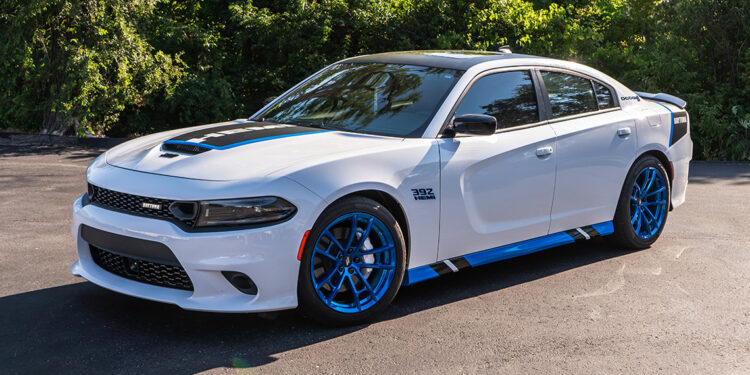 White 2022 Dodge Charger Scat Pack with Blue and Black Daytona Graphics.