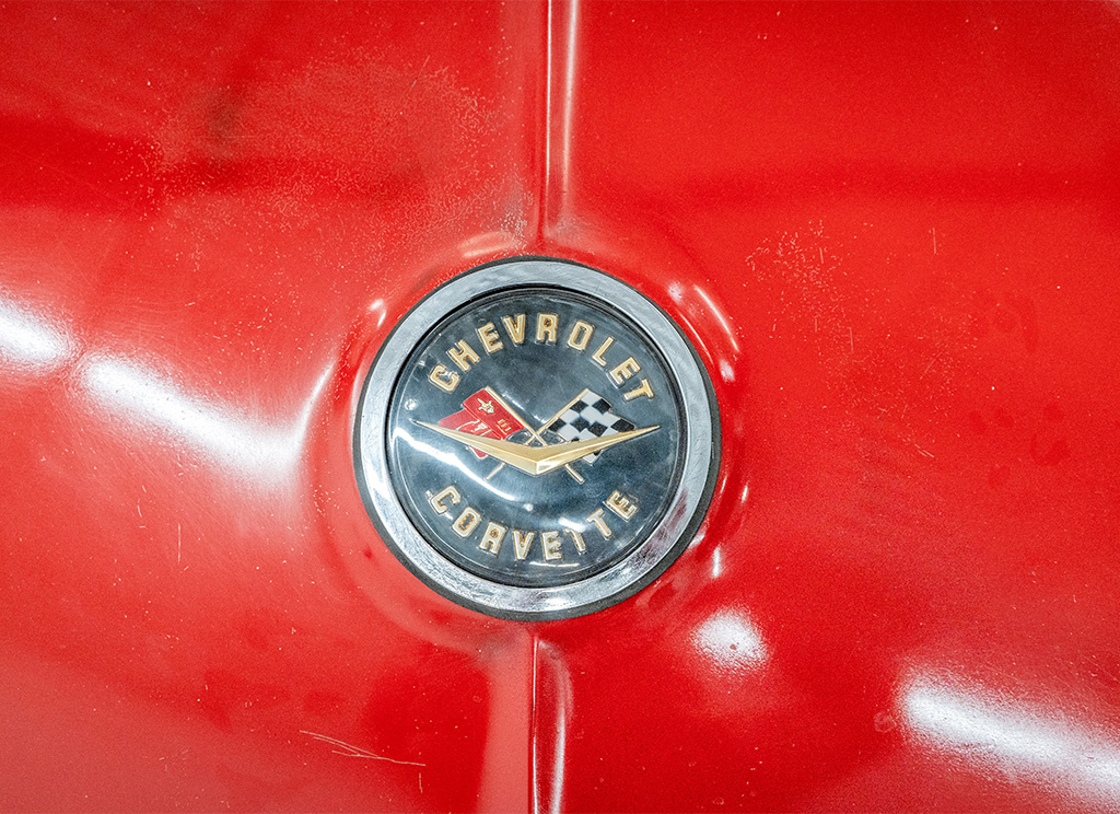 Original 1962 C1 Corvette rear circle emblem with wear and tear.