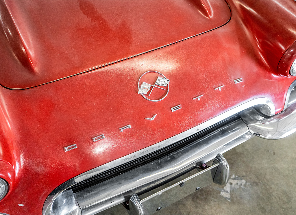 Original 1962 C1 Corvette front emblem with wear and tear.