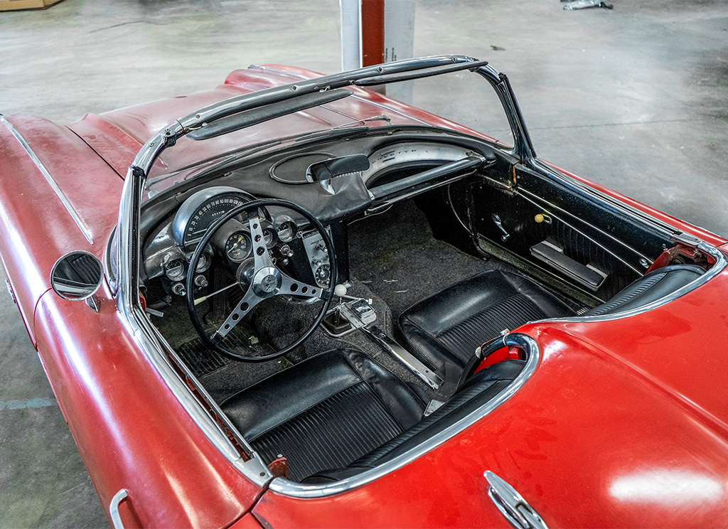 Weathered interior of an old 1962 C1 Corvette before restoration.