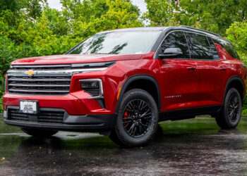 Custom 2024 Chevy Traverse with red and black two-tone styling.