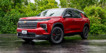 Custom 2024 Chevy Traverse with red and black two-tone styling.