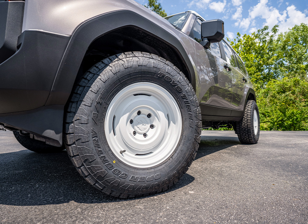 White Fifteen52 Analog HD steelie wheel design on a 2024 Toyota Land Cruiser.