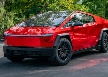 Red chrome Tesla Cybertruck with a custom vinyl wrap.