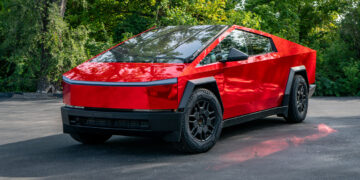 Red chrome Tesla Cybertruck with a custom vinyl wrap.