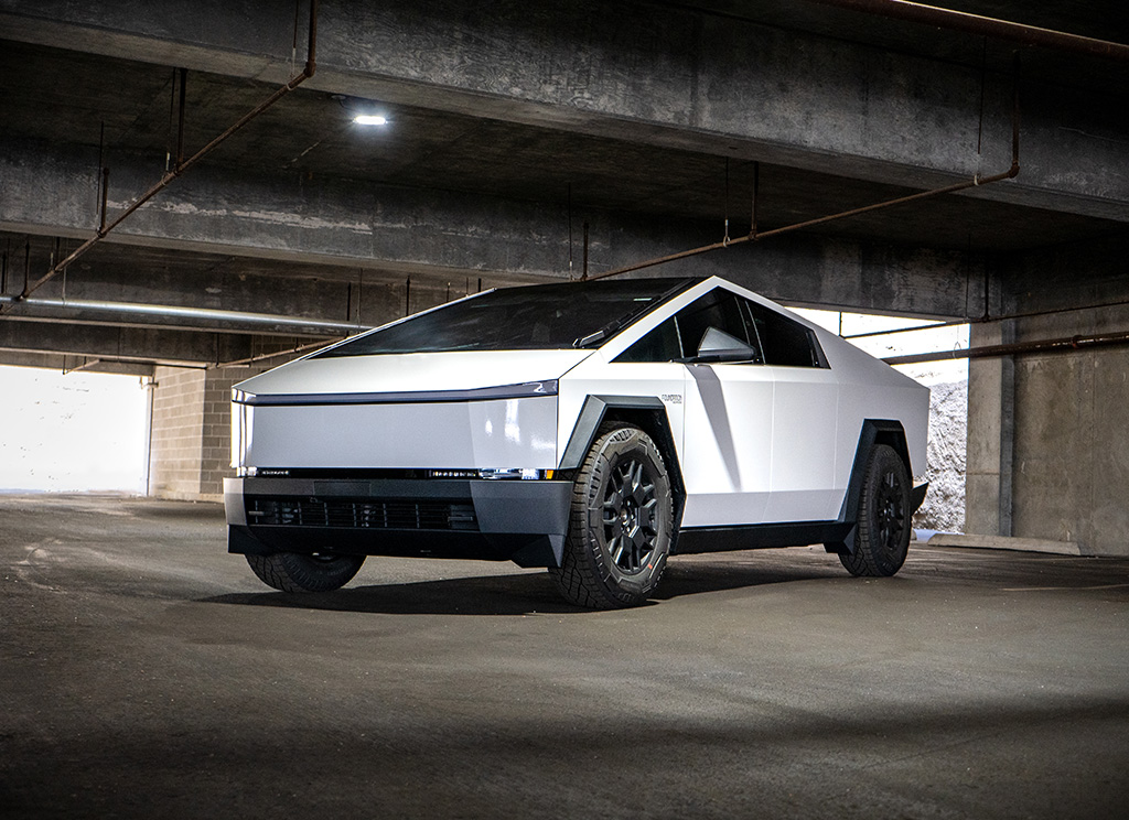 White Tesla Cybertruck in an underground parking garage.