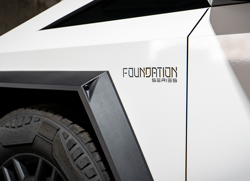 Front fender Foundation Series emblem on a white Cybertruck wrap.