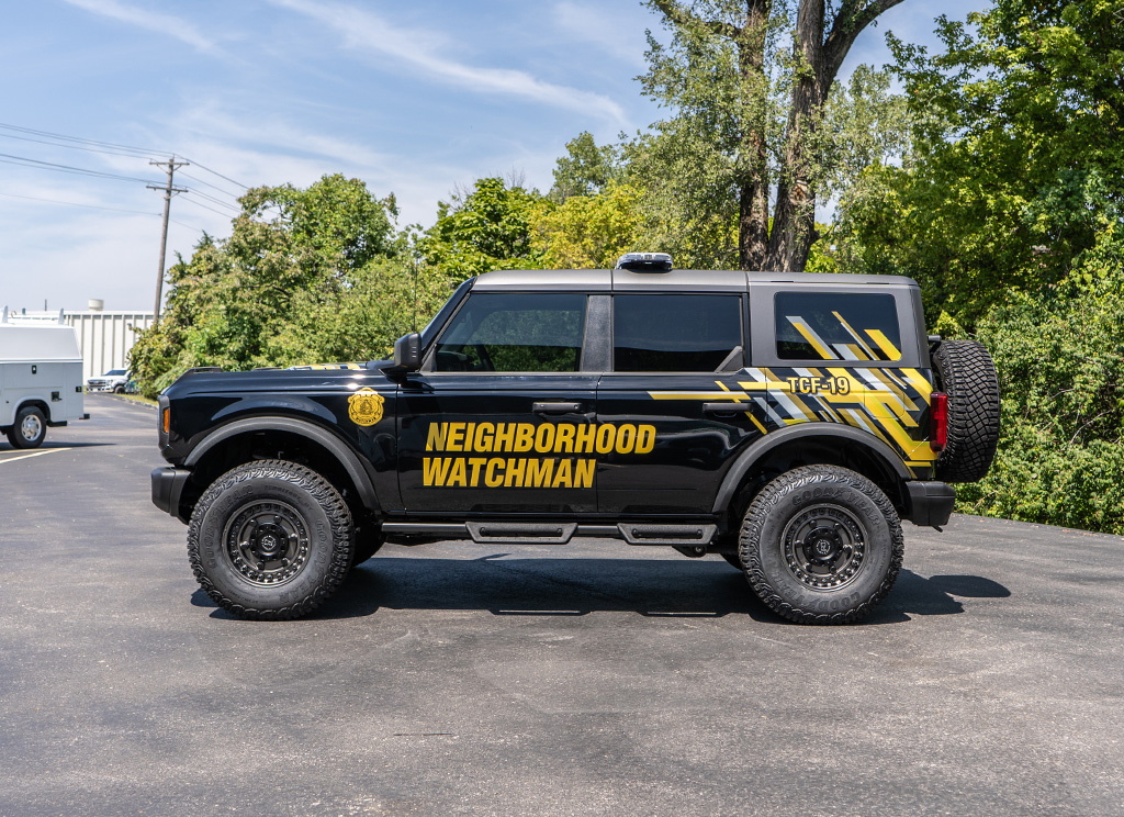 Side profile of a custom 2024 Ford Bronco SUV with auto accessories and vinyl graphics.