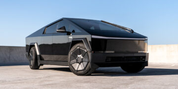 Gloss black Cybertruck wrap with metallic vinyl.