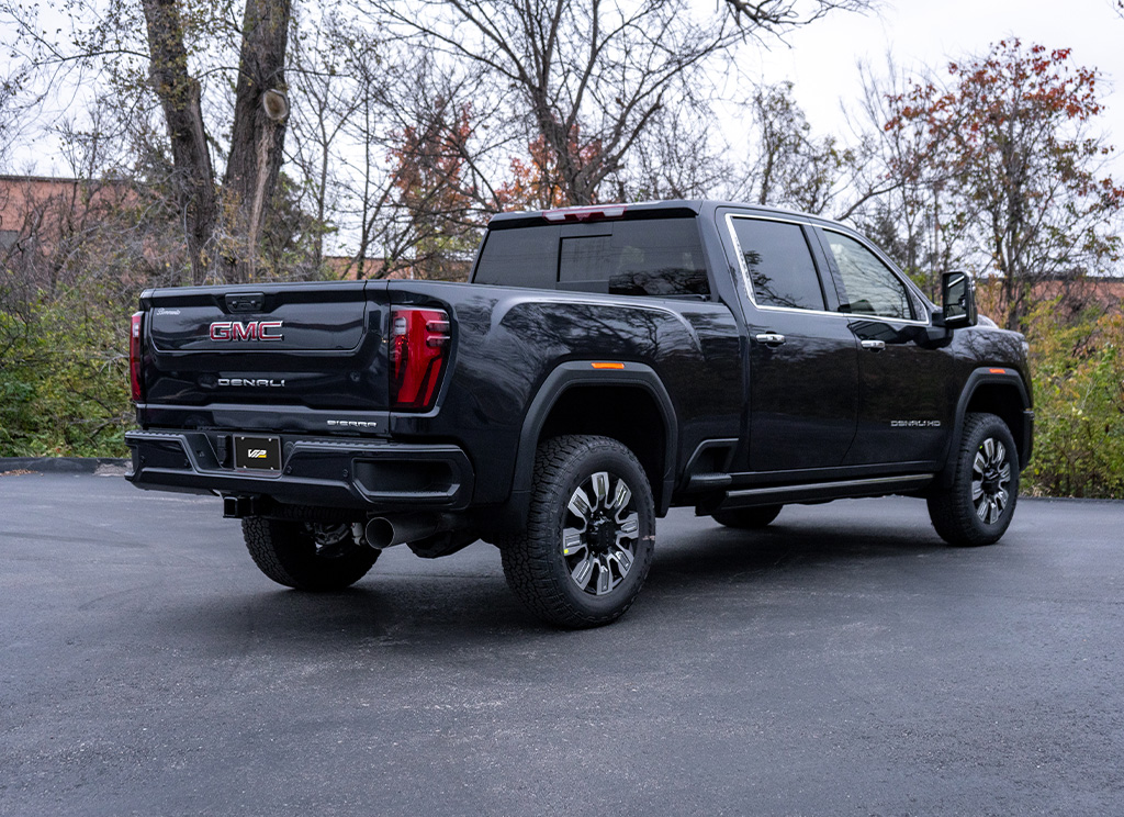 Rear angle view of a GMC Sierra HD 3500 with the original factory chrome.