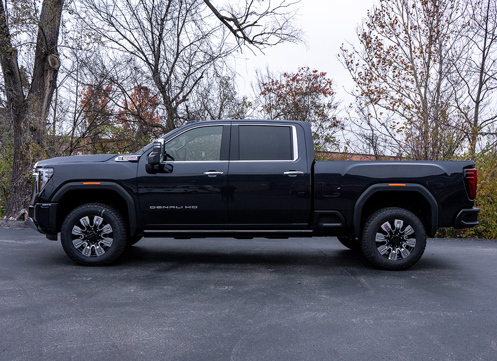 Side profile of a 2024 GMC Sierra HD 3500 with factory chrome.