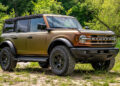 Bronze 2025 Ford Bronco with a 3M Volcanic Flare color flip vinyl wrap.