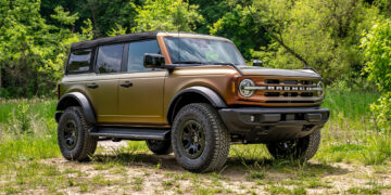 Bronze 2025 Ford Bronco with a 3M Volcanic Flare color flip vinyl wrap.