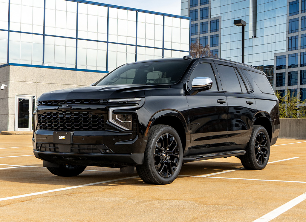 Front view of a custom blackout 2025 Chevy Tahoe with chrome delete trim and accents.
