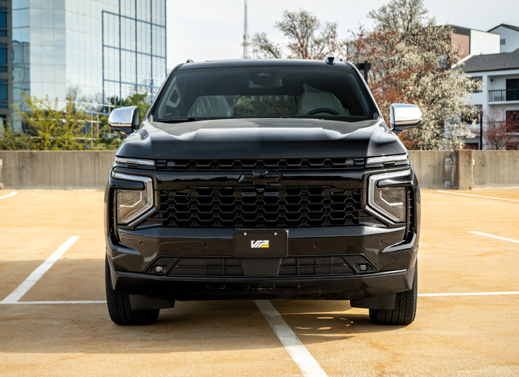 Custom chrome delete 2025 Chevy Tahoe with blackout grille and front bumper.