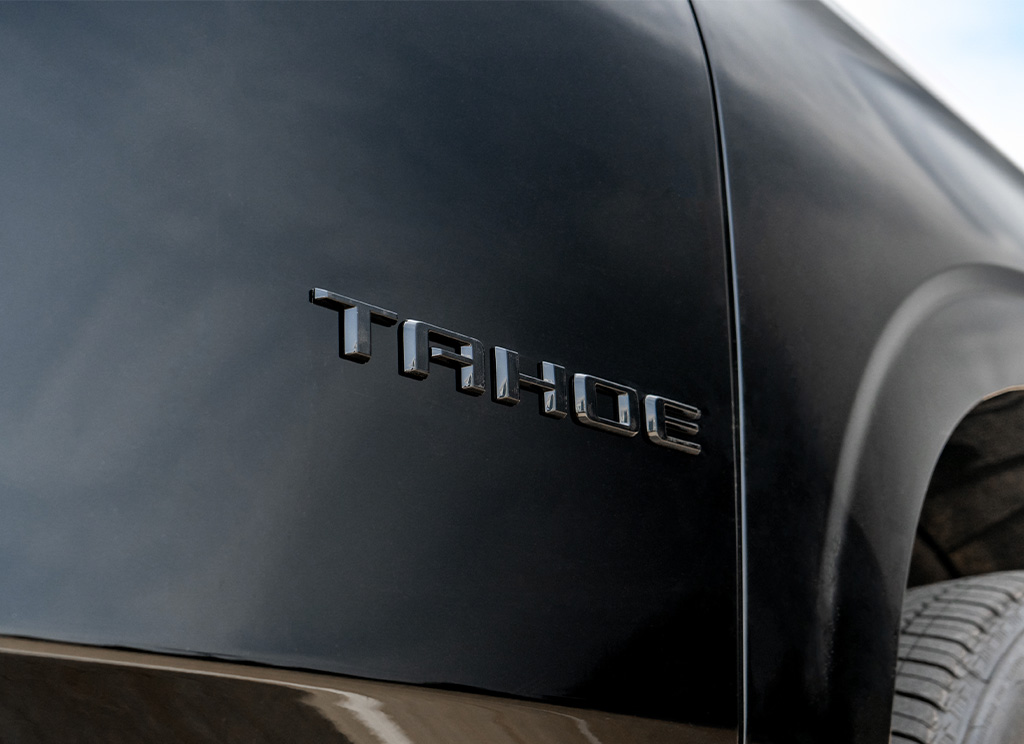 Black Chevy Tahoe nameplate lettering.