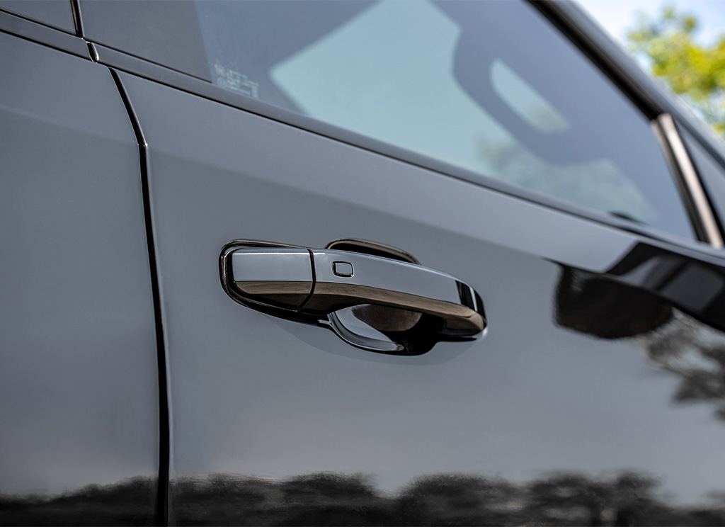 Close-up of black GMC Sierra 1500 door handles.